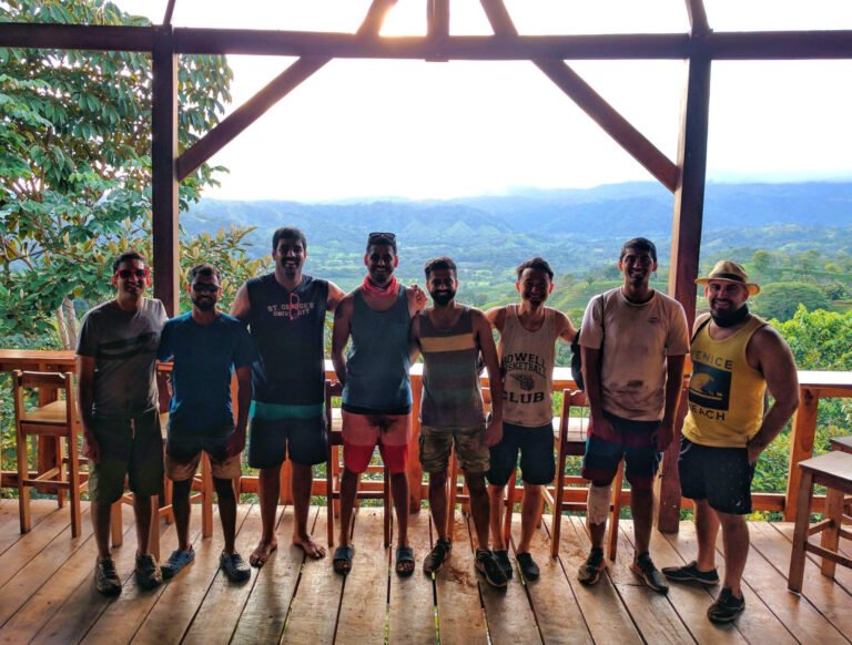 Group on the El Tigre deck with the valley and the Pacific behind them