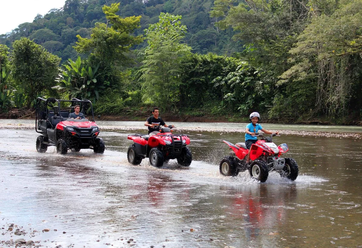 Riders crossing the Tulín River on ATVs outside Jaco