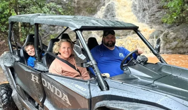 A family from the USA on an ATV rental at the Jaguar waterfalls in Jaco Costa Rica